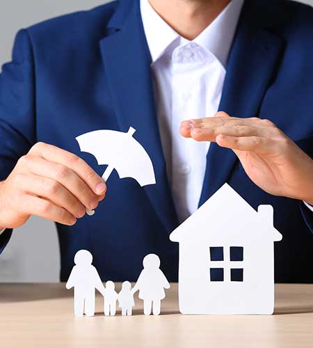 insurance agent holding hand and umbrella over a house